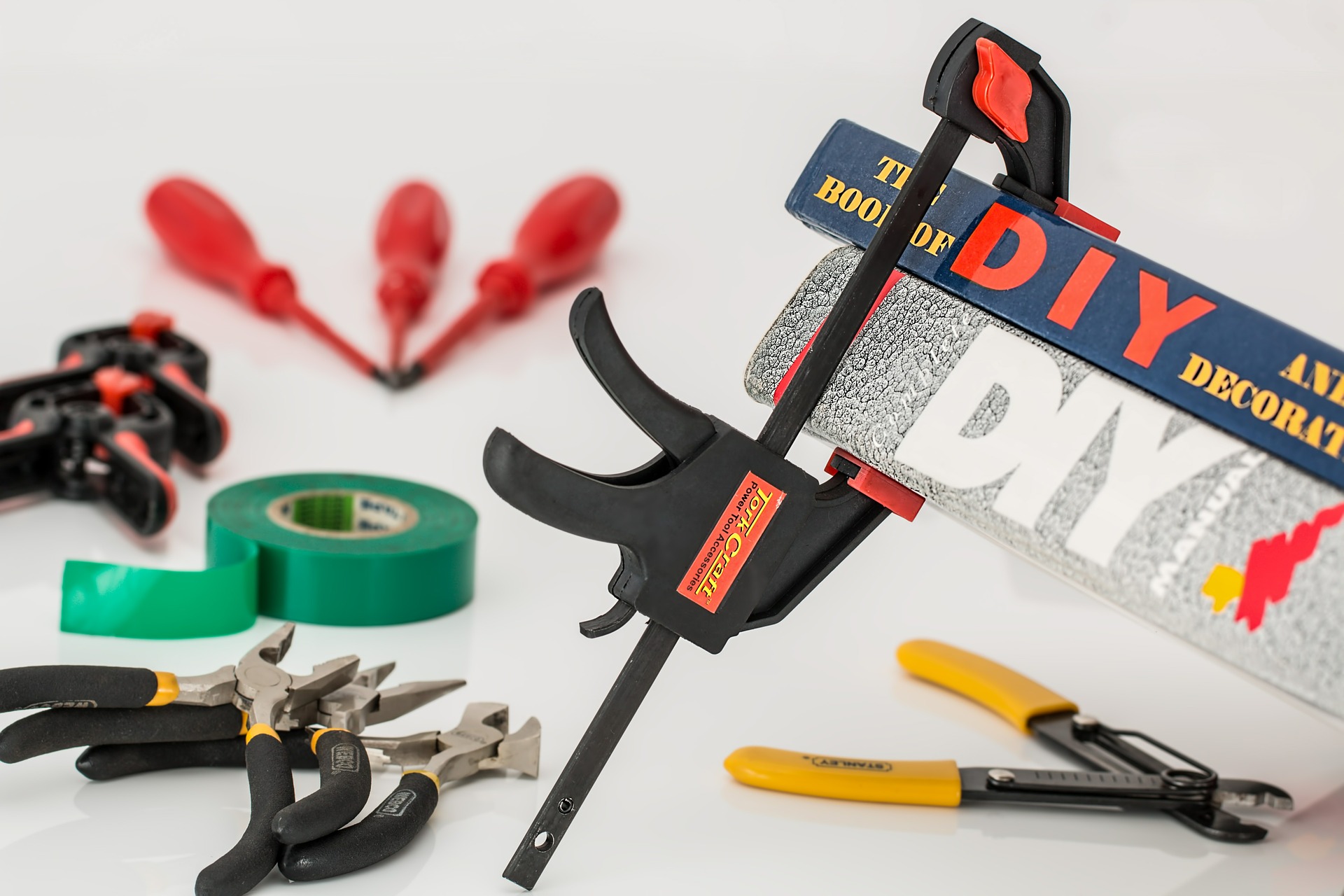 Crafting tools, tape, and a clamp