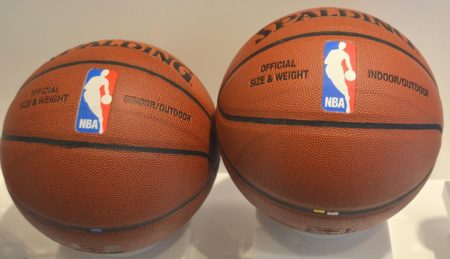 Authentic Spalding basketball next to a counterfeit