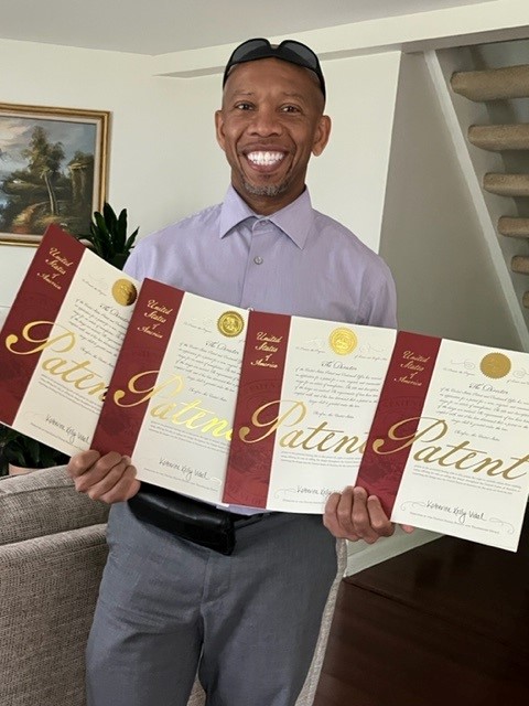 Gerald proudly shows off his 4 patents